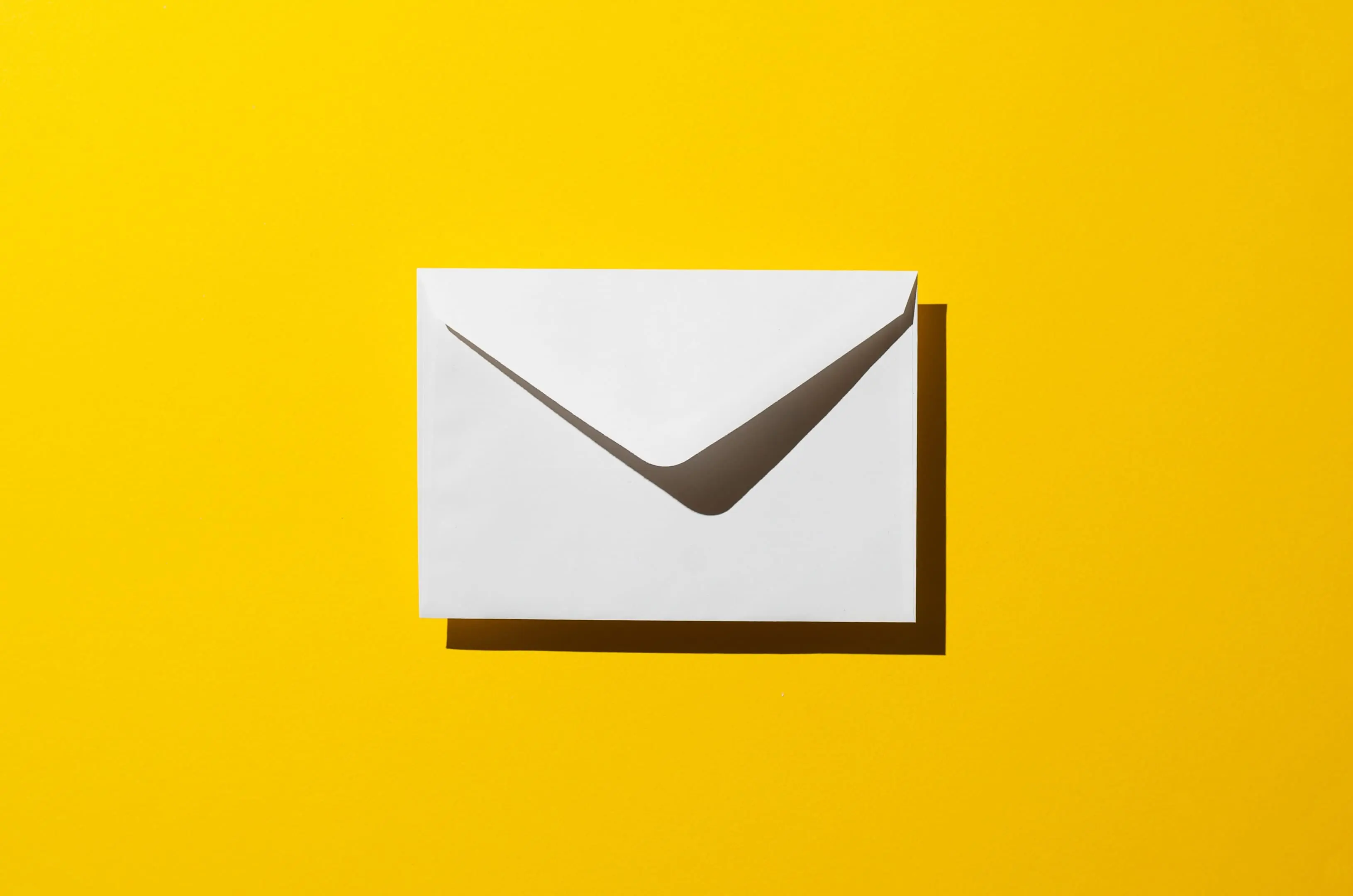 An enevelope on a bright yellow background