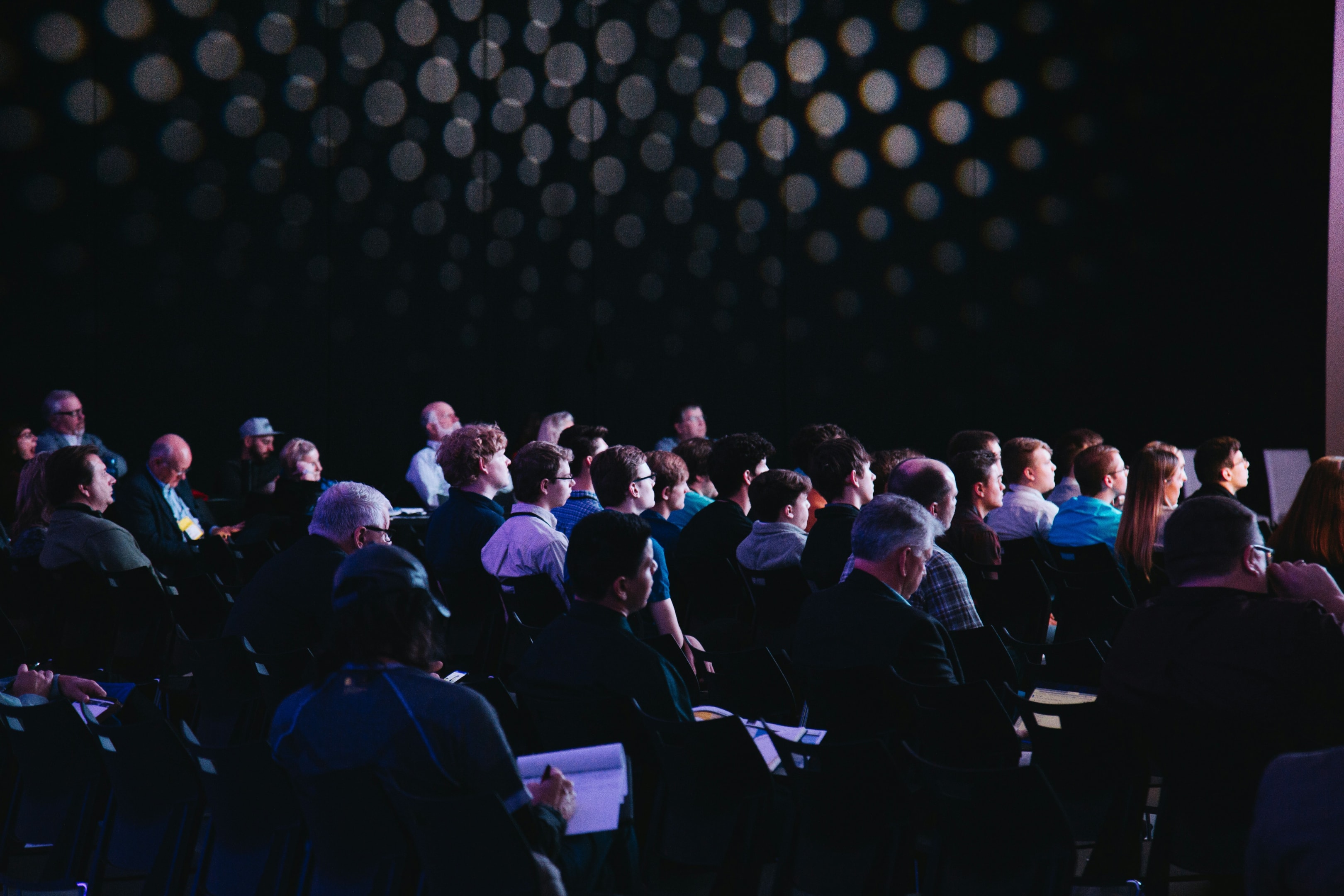 Dreamforce 2025 insights: Attendees captivated by the speaker during the conference.