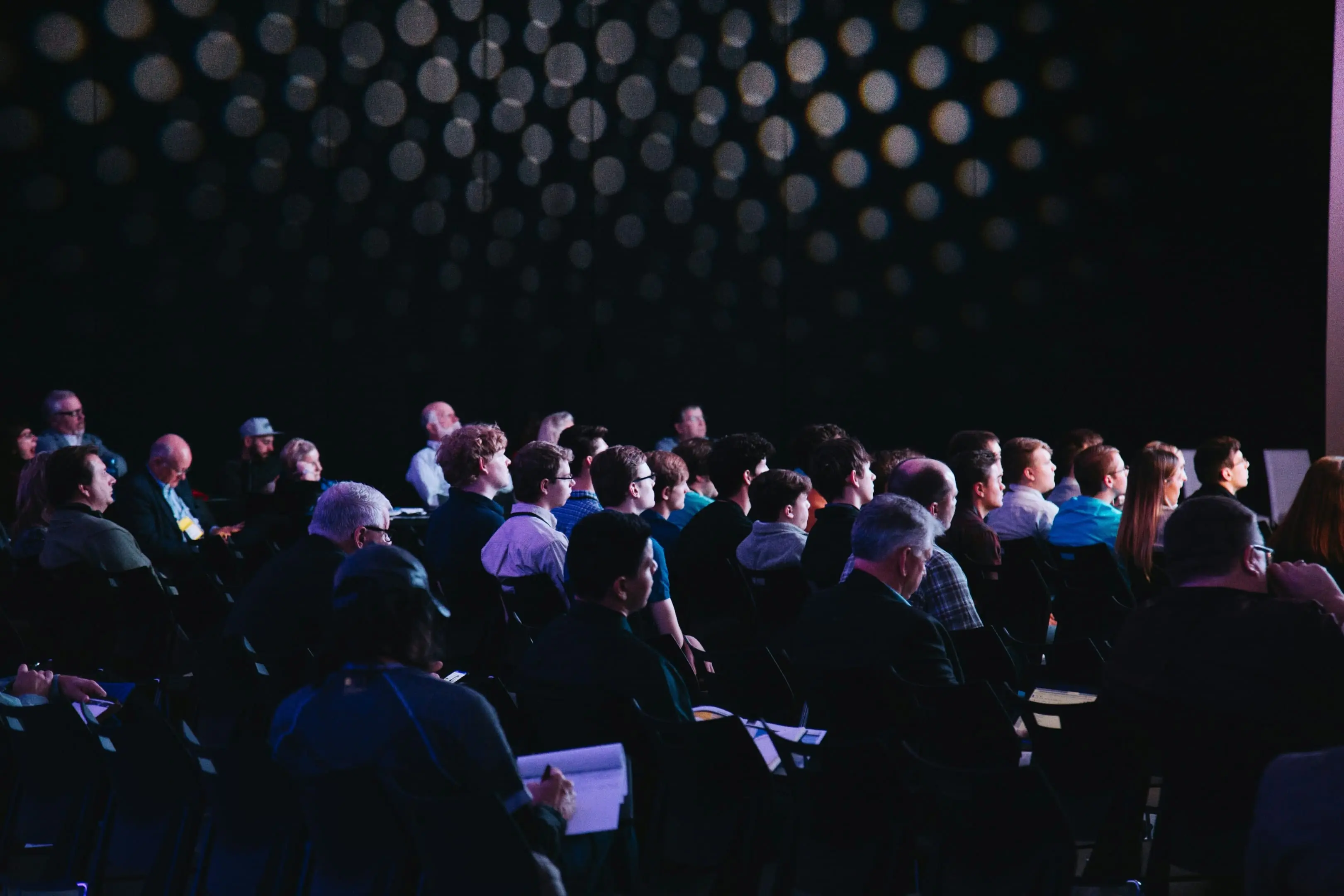 Dreamforce 2025 insights: Attendees captivated by the speaker during the conference.